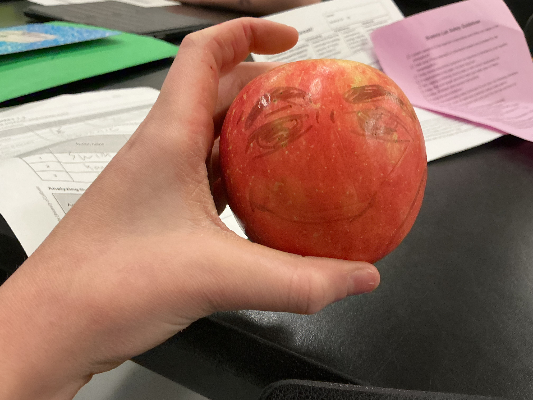 Science was boring so I stole some kids apple and drew this on it. He still ate it, but god class sucks