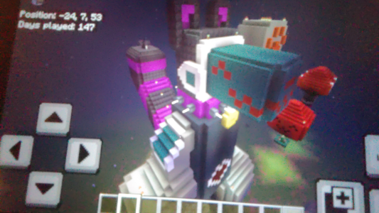 Tem said that i should try to smooth Minecraft Nooki out with stairs, so i had to do a bit of block replacing to make it work, cuz last i checked, concrete and terracota stairs didn't exist, so his screens and visor are made of warped planks and stairs. i also smoothed his tail and head a bit using stairs that were close enough in color to Netherite. and yes, he has a name tag now! and whatever those side screens on the visor are. that's it, hopefully he still looks very good.
sorry for the blurriness.